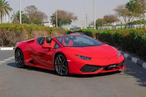 Red Lamborghini Huracan parked on the street - Lamborghini price in Dubai